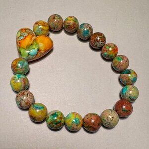 bracelet brings a bright, artistic, and joyful feel to any outfit